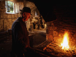 Breganze. A blacksmith at work in a XV century mallet